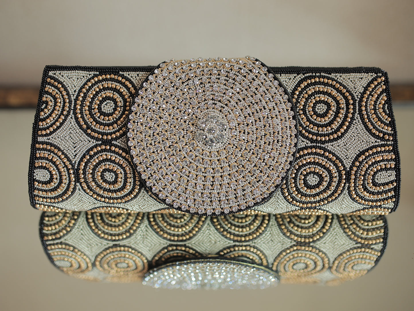 Black and Copper Circular Pattern Diamontee Round Flap Clutch