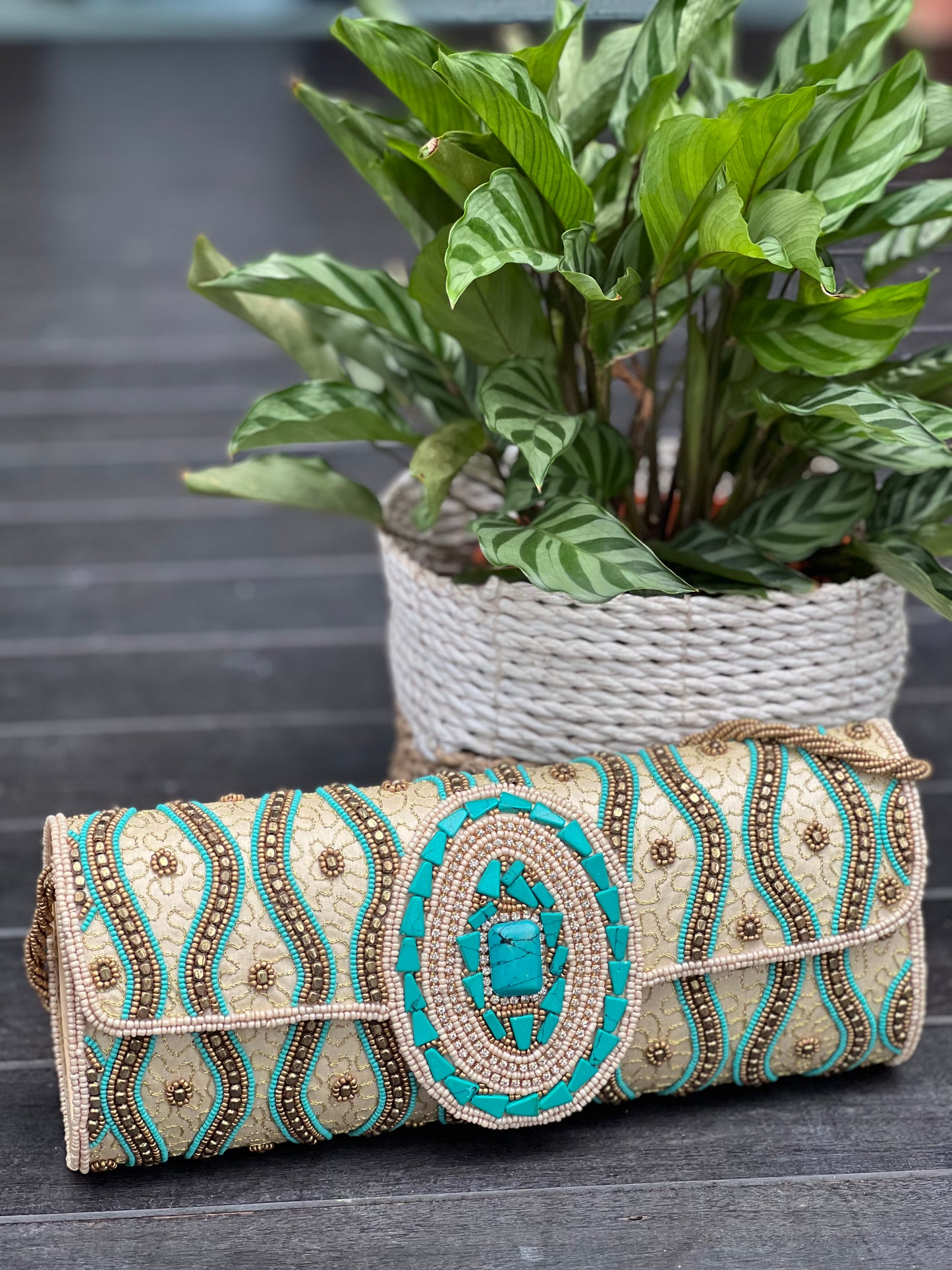 Beige and Turquoise tubular clutch with a flap