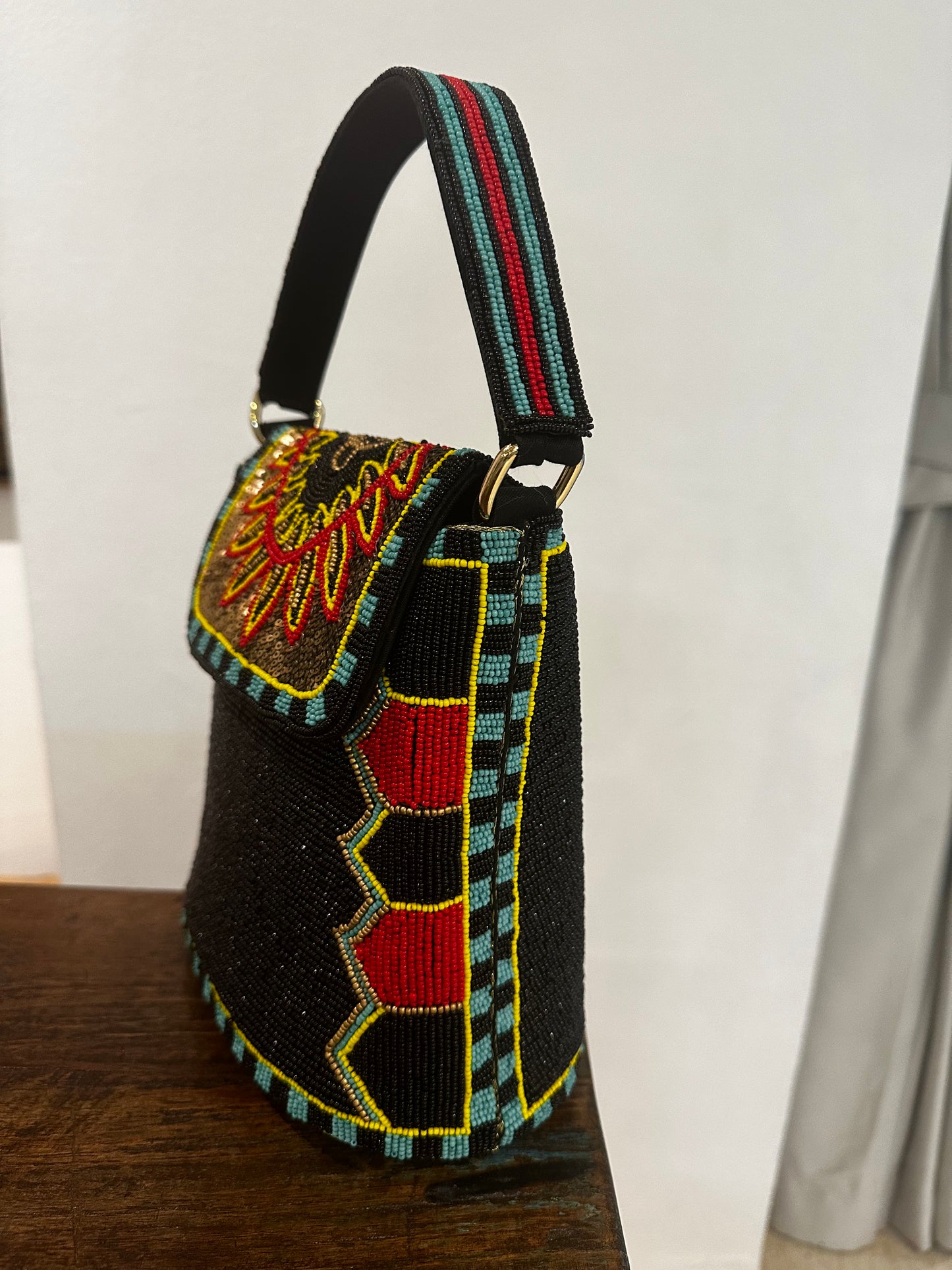 Black Bucket Bag with a multicolour flap