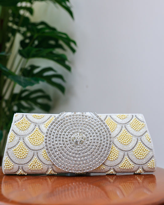 Cream beaded clutch with a diamontee round flap