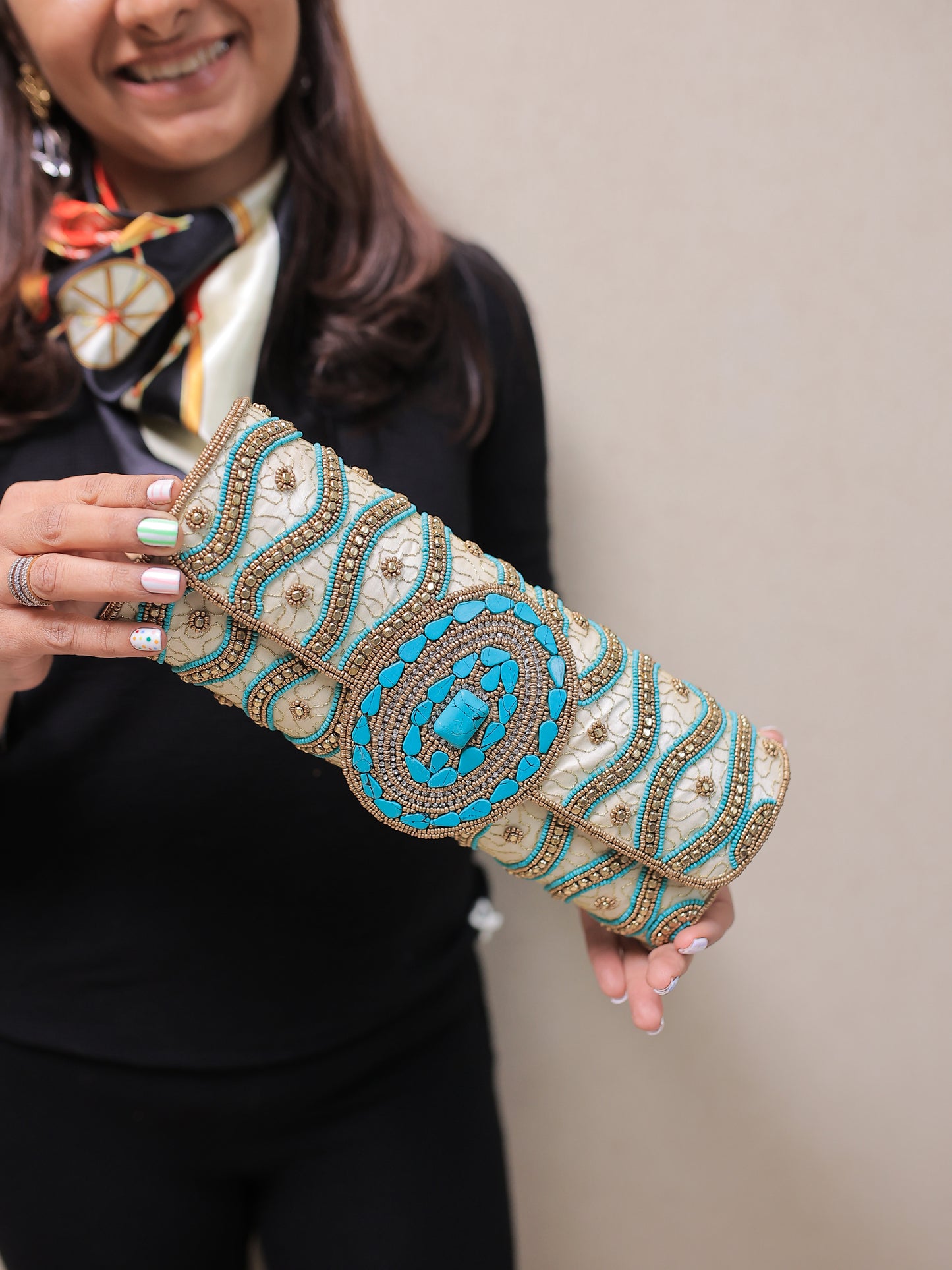 Beige and Turquoise tubular clutch with a flap