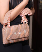 The Rosé Tassel Clutch