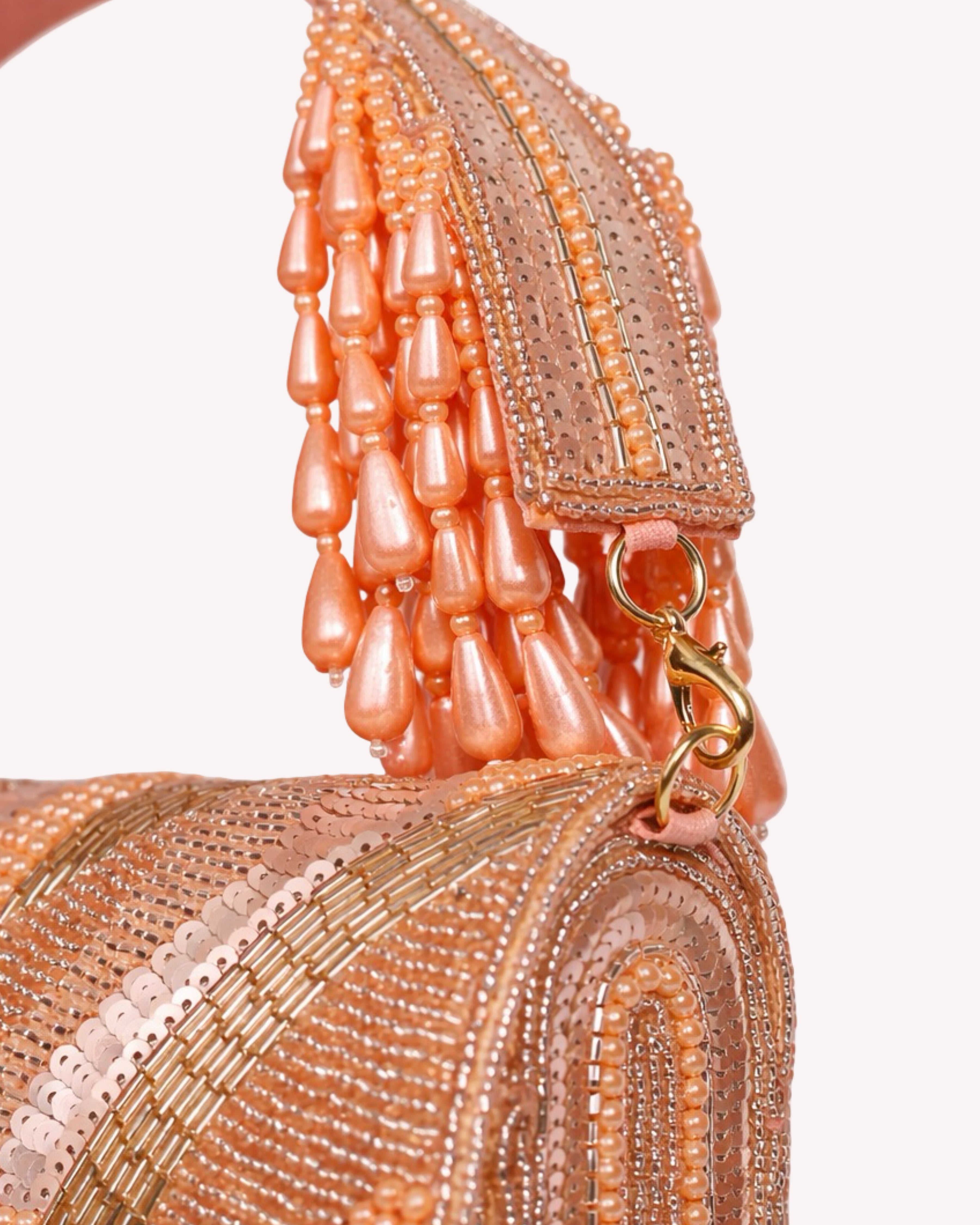 The Rosé Tassel Clutch